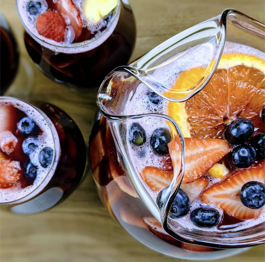 Pitcher of sangria with fresh fruit on top