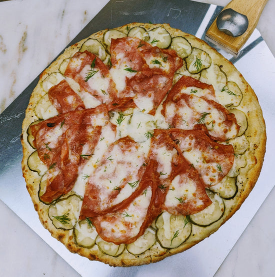 Pickle and mortadella pizza