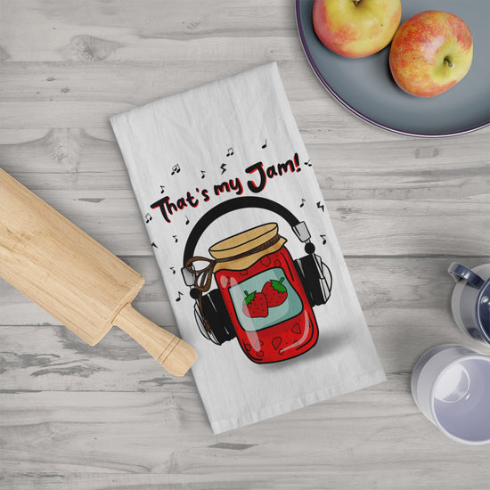Funny cotton tea towel with jam jar and headphones design – perfect kitchen gift for music lovers.

That’s My Jam whimsical dish towel – cute and absorbent 100% cotton kitchen accessory.

Hand-drawn foodie tea towel with music pun – fun gift idea for home cooks and bakers.

Playful cotton tea towel with quirky jam jar illustration – retro-inspired kitchen decor.

Funny food pun kitchen towel – That’s My Jam design for chefs, foodies, and music fans.

Cute cotton dish towel with whimsical jam jar print – sty